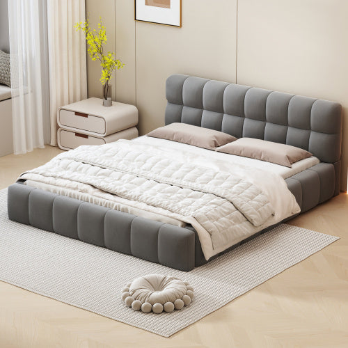 A double bed with a backrest made of soft linen