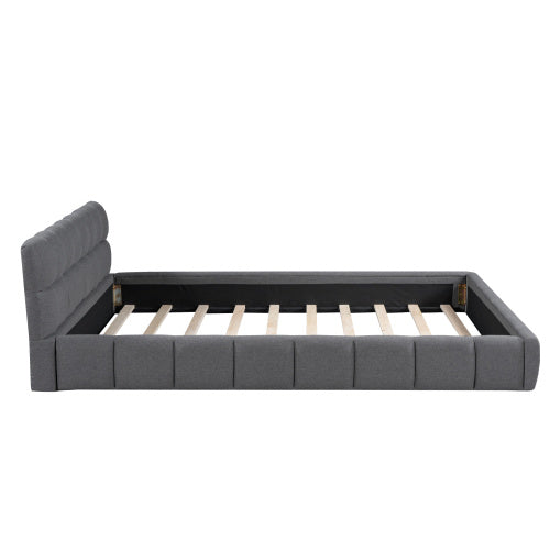 A double bed with a backrest made of soft linen