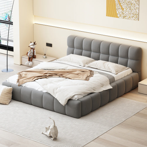 A double bed with a backrest made of soft linen