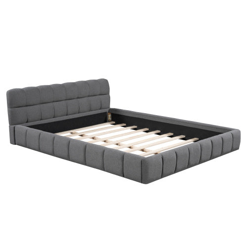 A double bed with a backrest made of soft linen
