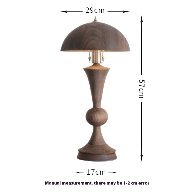 An antique solid wood table lamp