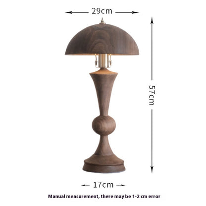 An antique solid wood table lamp